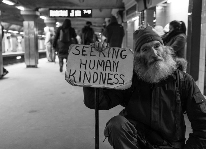 Homeless man with sign